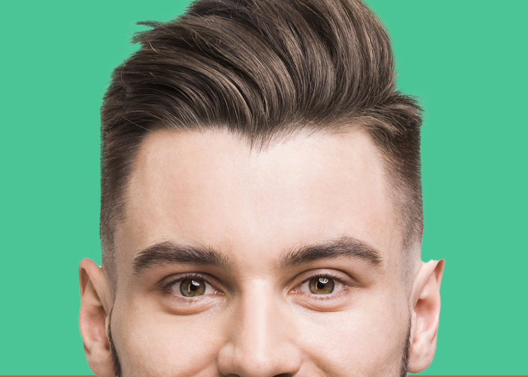 A man with fair skin, brown hair and a side part looks forward in front of a green background.