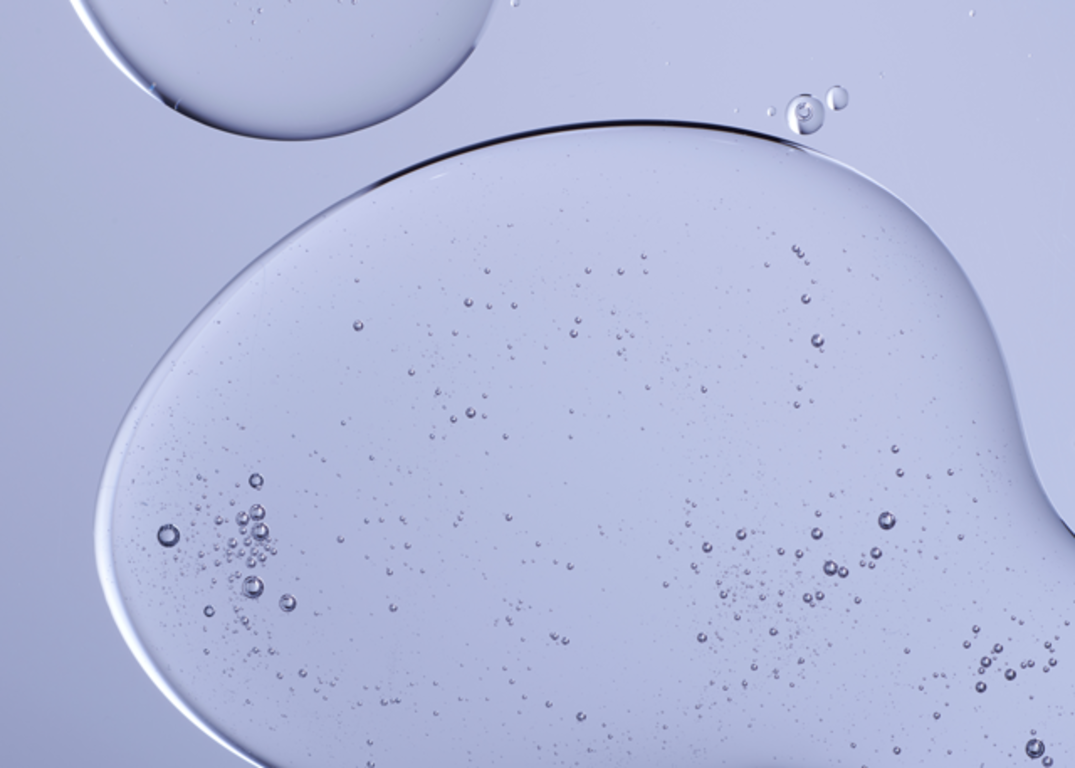 Keratin treatment lays on a light blue surface.