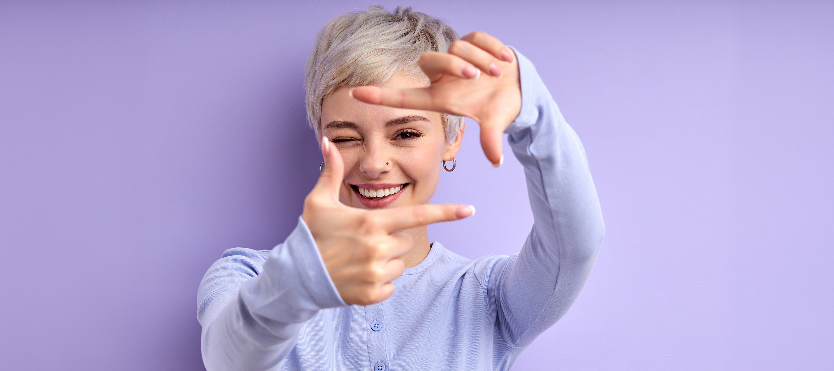 Cheerful happy woman with short hair laughing, feeling happiness